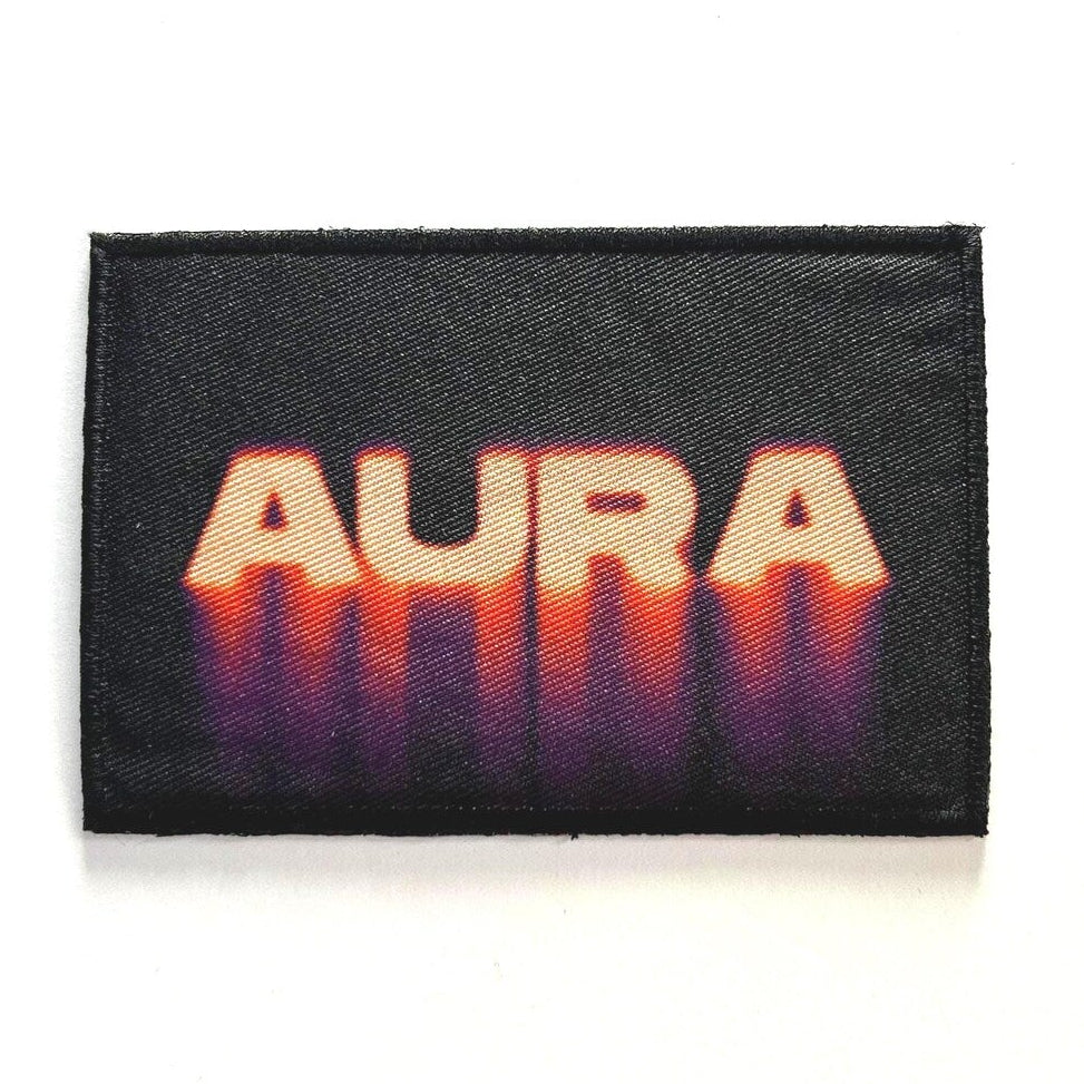Black patch with 'AURA' in orange gradient on a white background