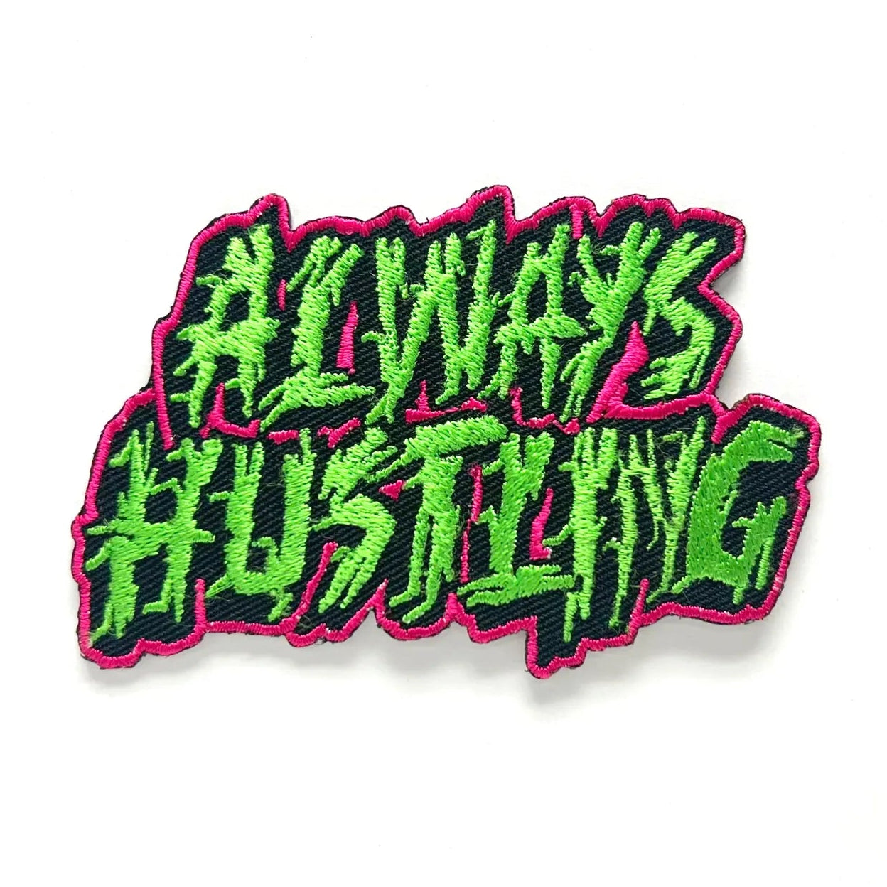 Embroidered patch with 'Always Hustling' text in green and pink on a white background
